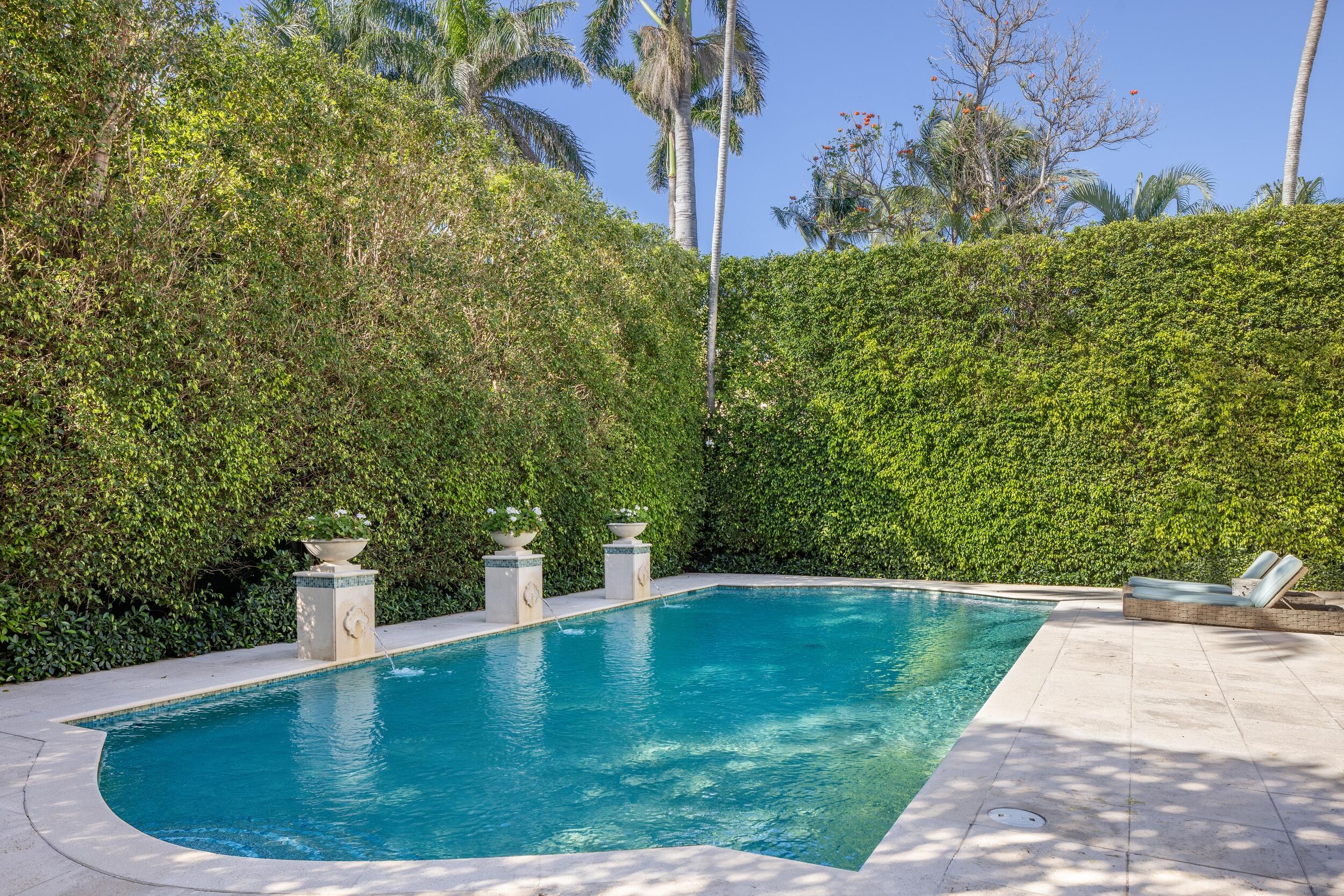 130 Cocoanut Row Palm Beach, FL 33480 - Photo 57 of 66 a view of a swimming pool with a patio