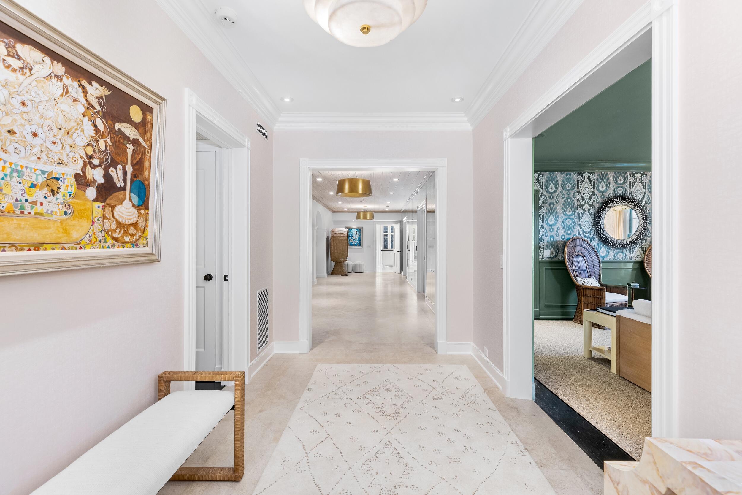 130 Cocoanut Row Palm Beach, FL 33480 - Photo 6 of 66 a view of a hallway to a livingroom with furniture and a window