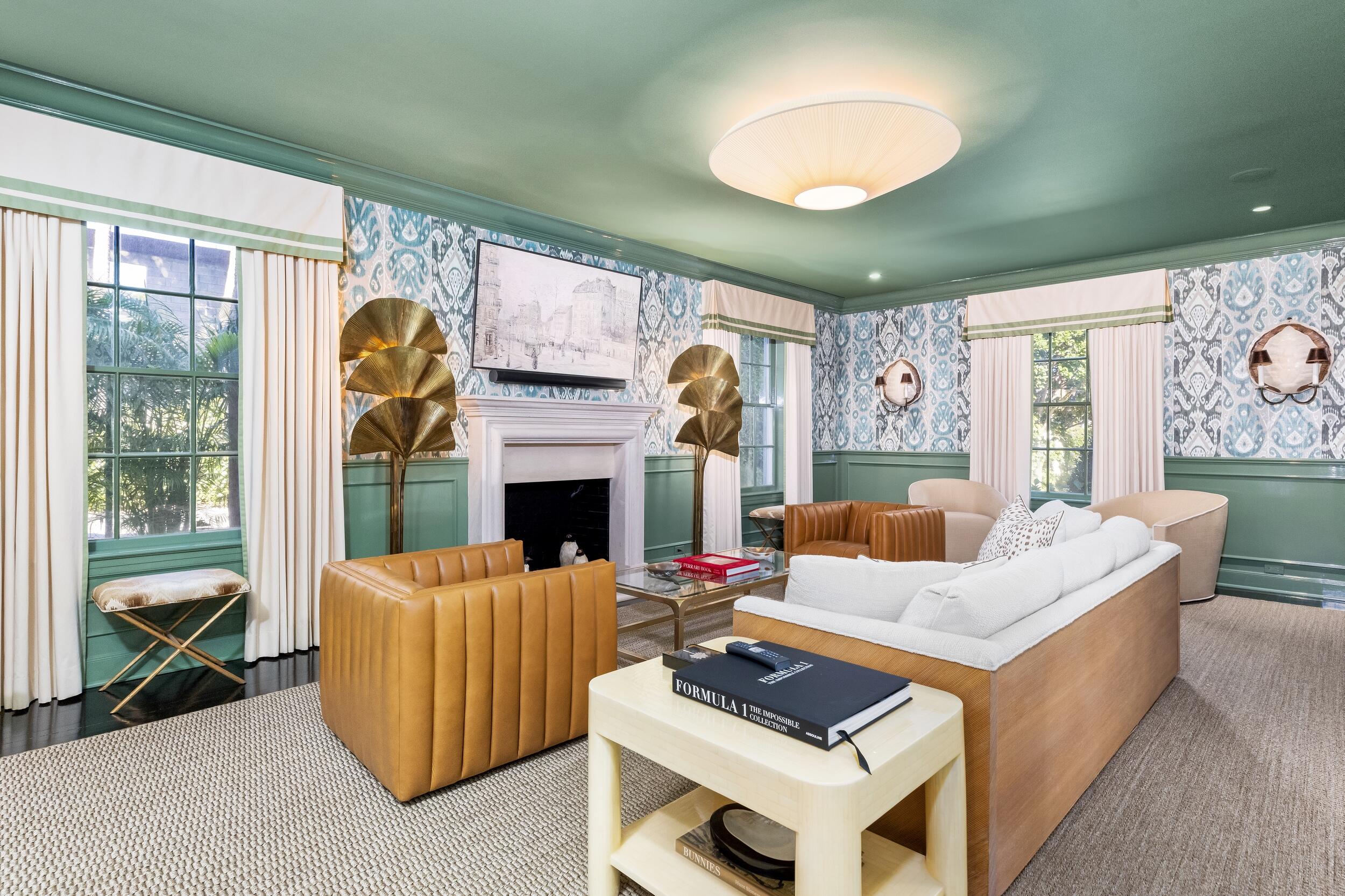 130 Cocoanut Row Palm Beach, FL 33480 - Photo 7 of 66 a living room with furniture a fireplace and a large window