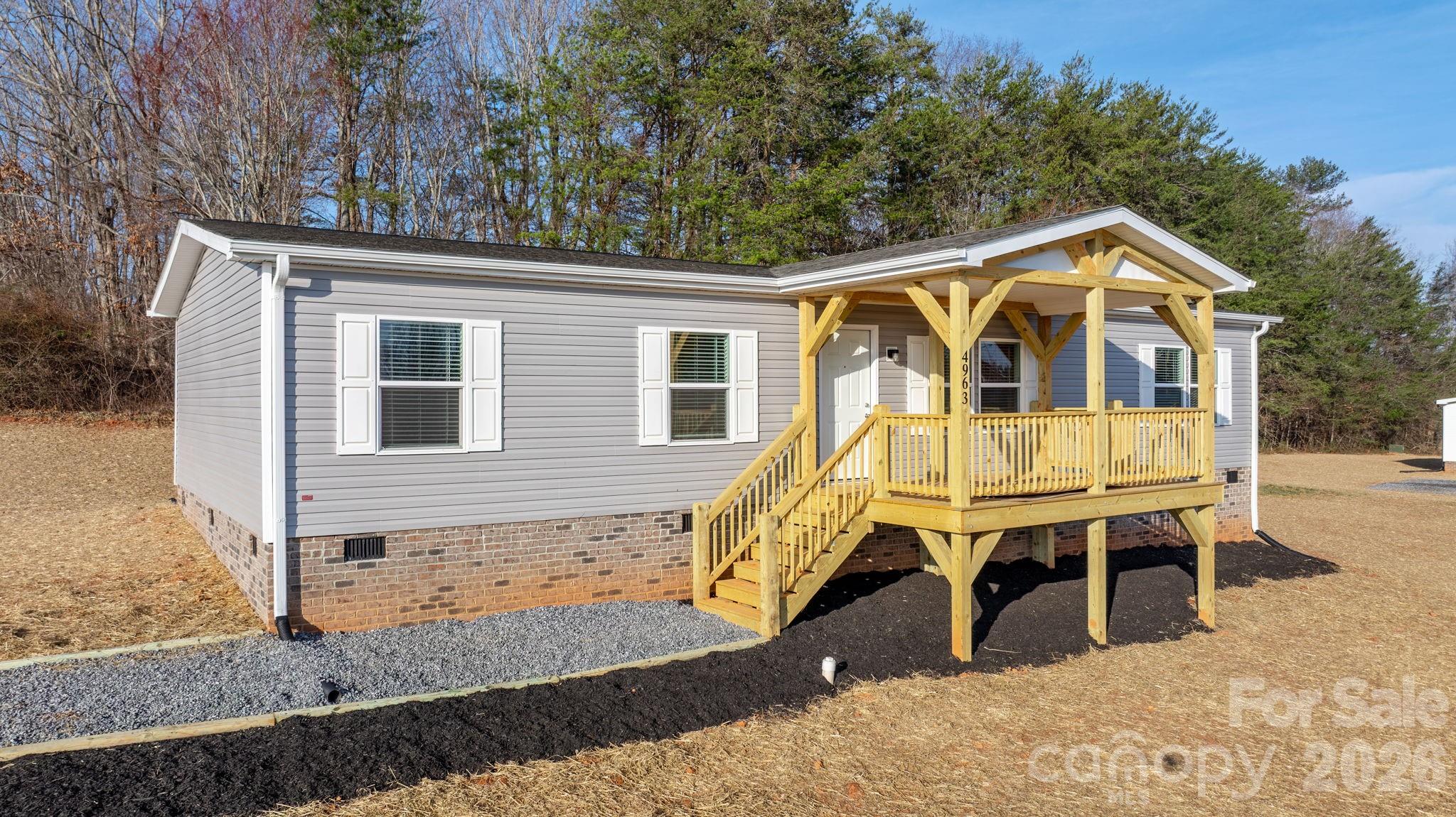 4935 Rhoney Road Connelly Springs, NC 28612 - Photo 1 of 36 a view of a house with a patio