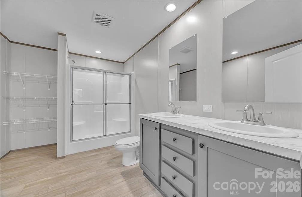 4935 Rhoney Road Connelly Springs, NC 28612 - Photo 20 of 36 a bathroom with a granite countertop sink mirror and double