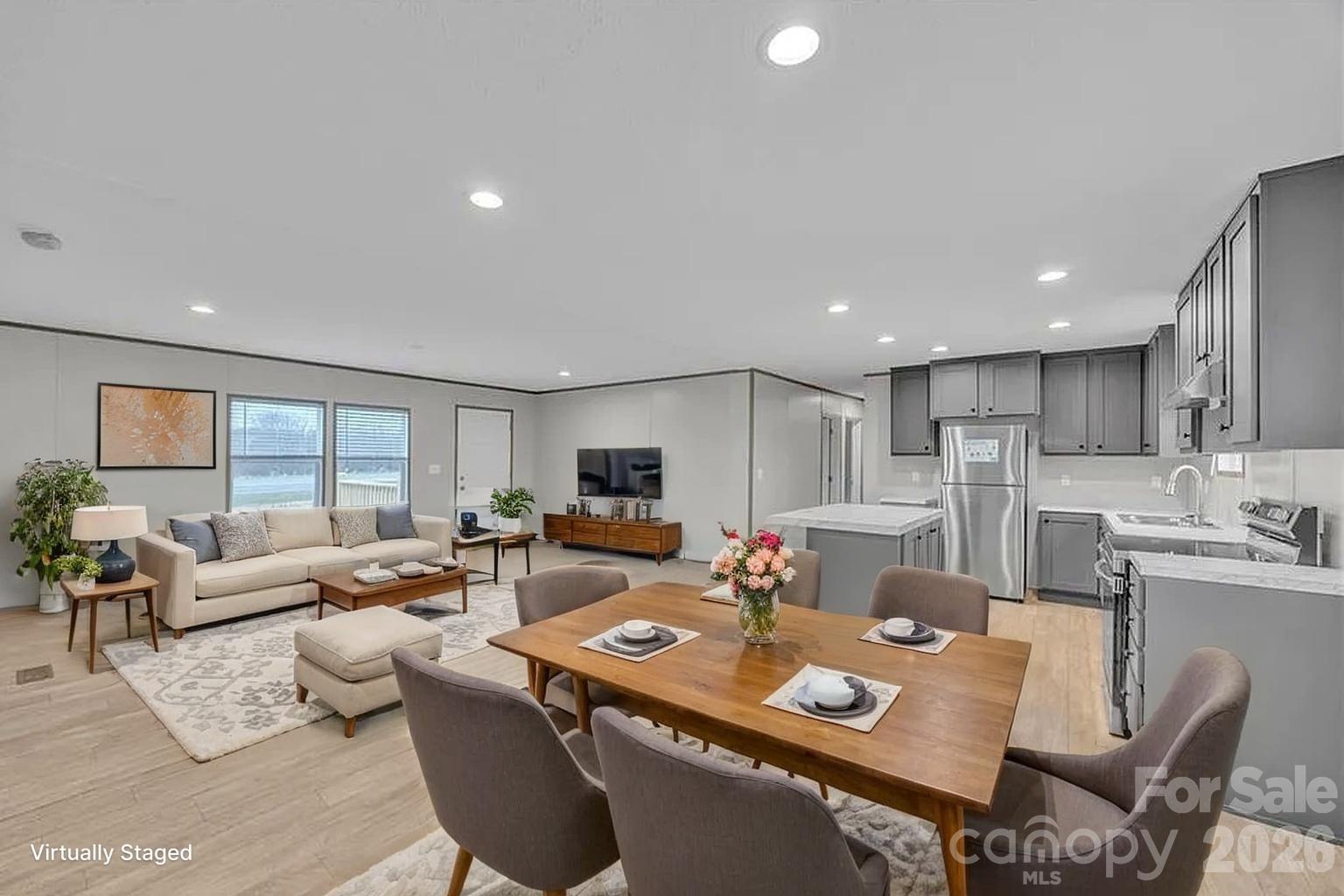 4935 Rhoney Road Connelly Springs, NC 28612 - Photo 2 of 36 a living room with furniture kitchen view and a large window