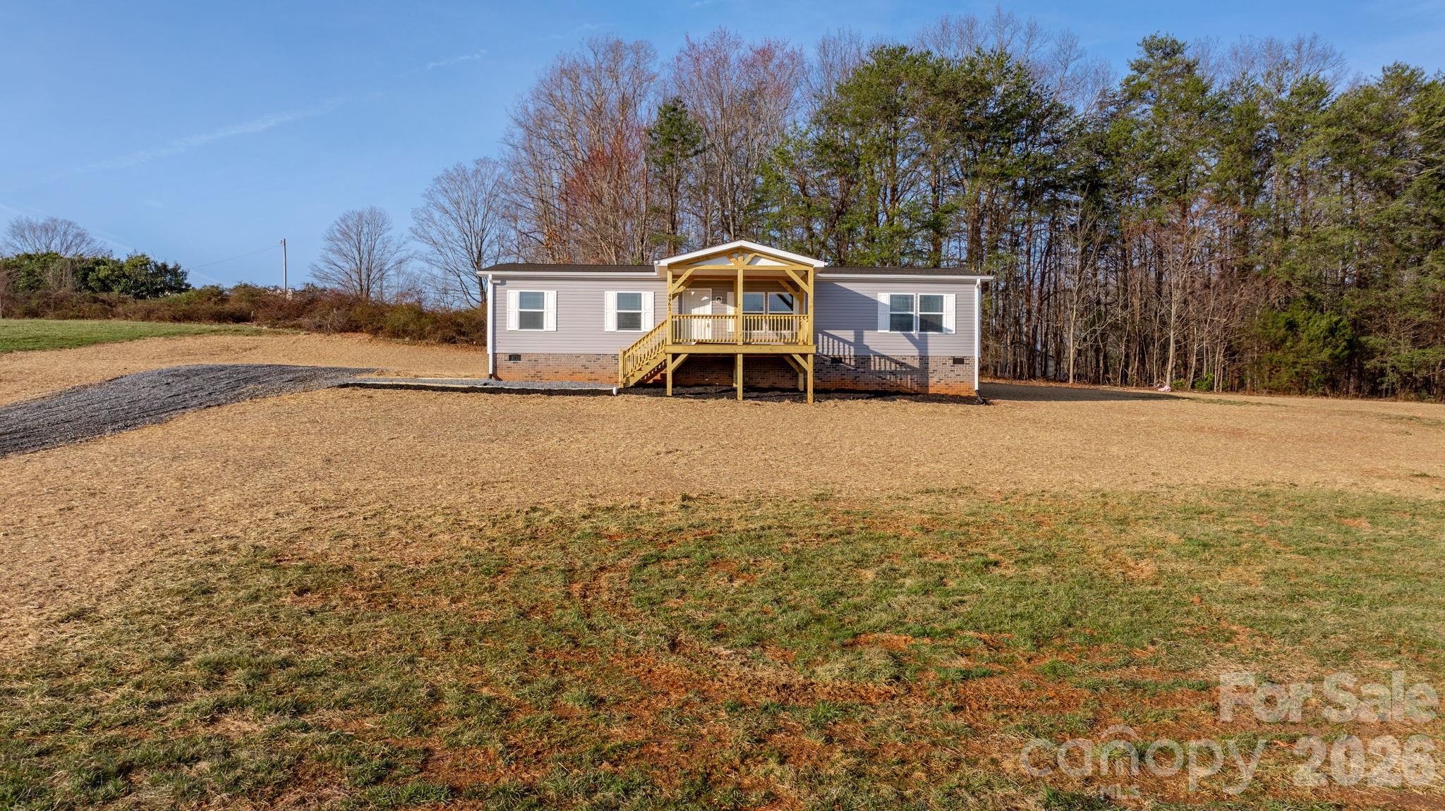 4935 Rhoney Road Connelly Springs, NC 28612 - Photo 30 of 36 a front view of a house with a yard