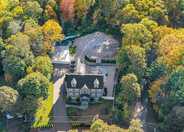an aerial view of house with yard swimming pool and outdoor seating