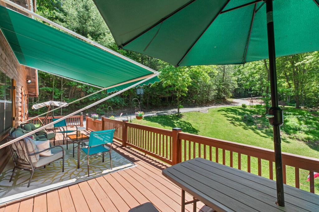 66 Fortenberry Road Young Harris, GA 30582 - Photo 44 of 55 a view of balcony with furniture and umbrella