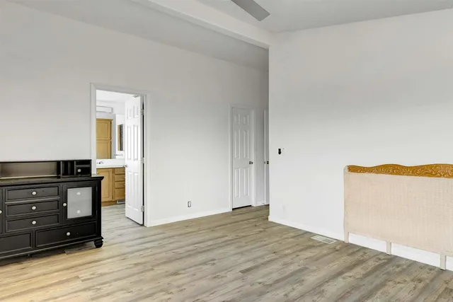 a view of empty room with furniture and cabinet