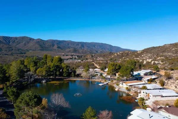 an aerial view of residential house with outdoor space and river