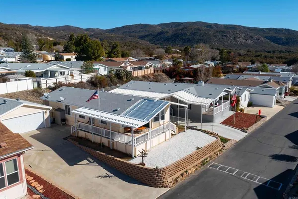 an aerial view of residential houses with outdoor space