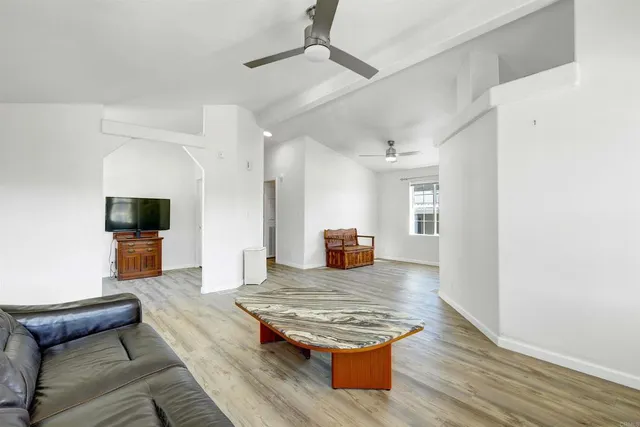 a living room with furniture and a window