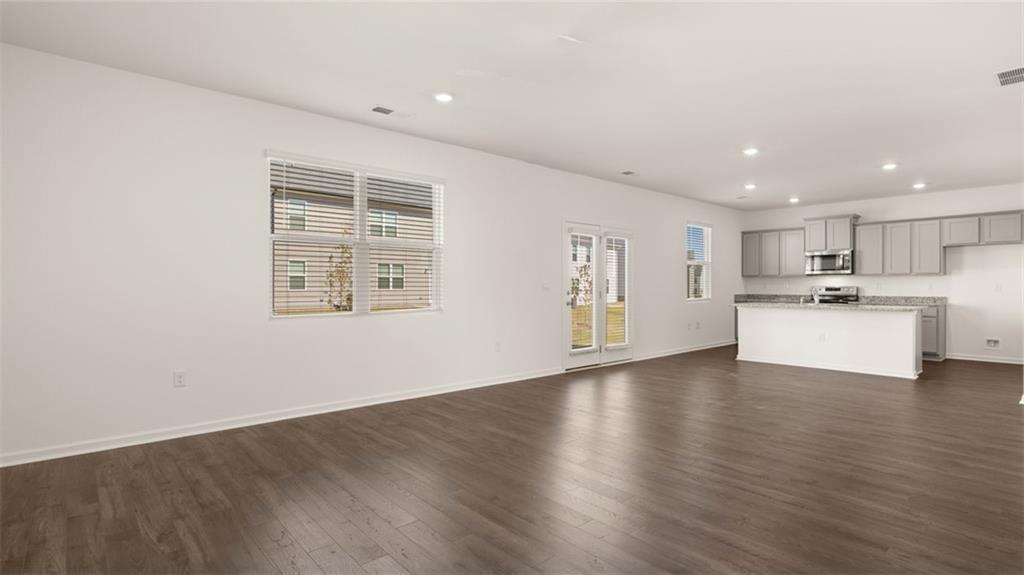 81 White Spruce Way Newnan, GA 30265 - Photo 15 of 39 a view of a kitchen with a sink dishwasher stove top oven and refrigerator