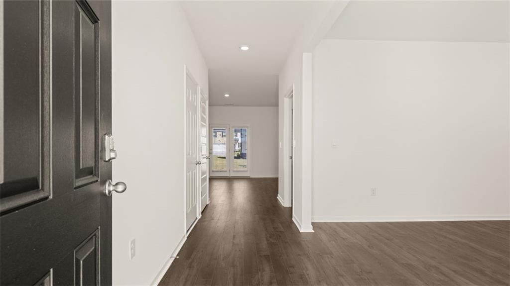 81 White Spruce Way Newnan, GA 30265 - Photo 3 of 39 a view of a hallway with wooden floor
