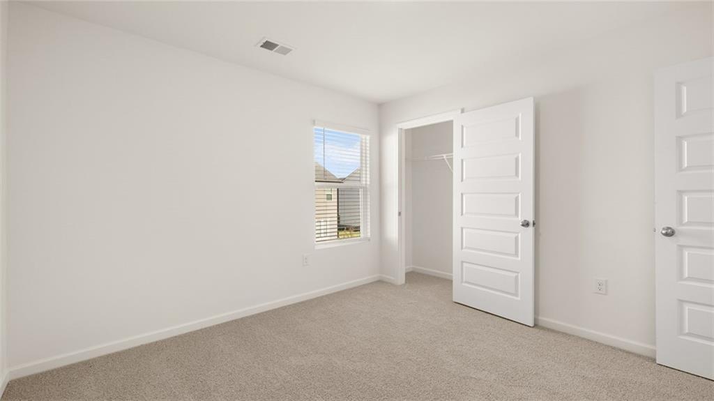 81 White Spruce Way Newnan, GA 30265 - Photo 34 of 39 an empty room with windows