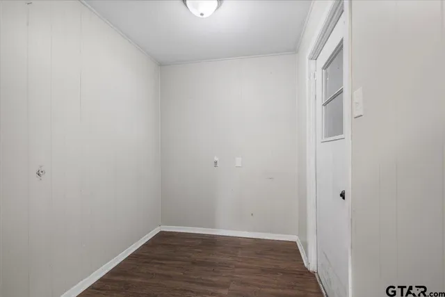 a view of a hallway with a ceiling fan