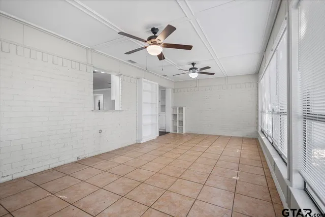 a bathroom with a granite countertop sink mirror and toilet