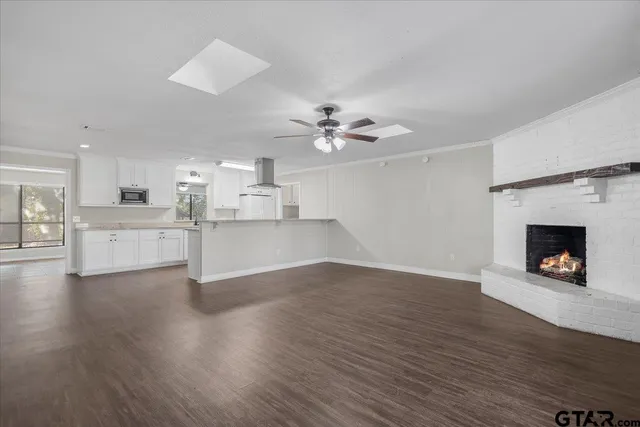 a view of a kitchen with wooden floor