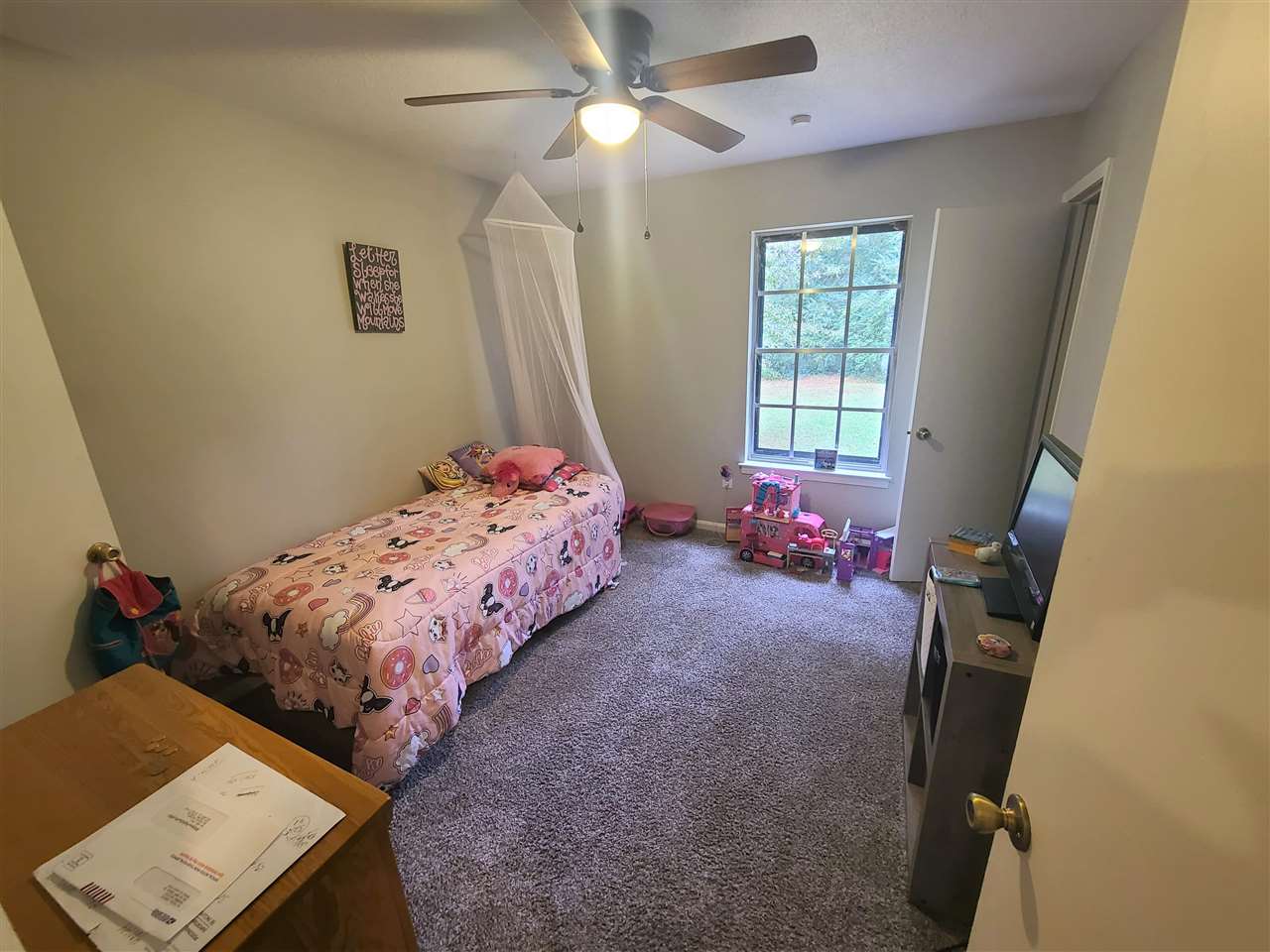 915 Greenview Road Collierville, TN 38017 - Photo 9 of 13 a bedroom with bed and a window