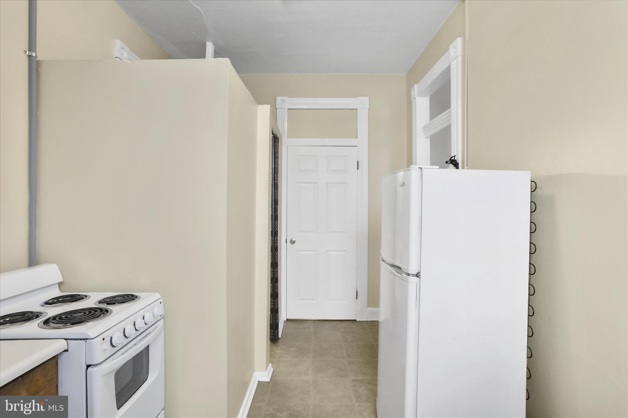 315 Frederick Street Cumberland, MD 21502 - Photo 16 of 46 a kitchen with a refrigerator and a stove