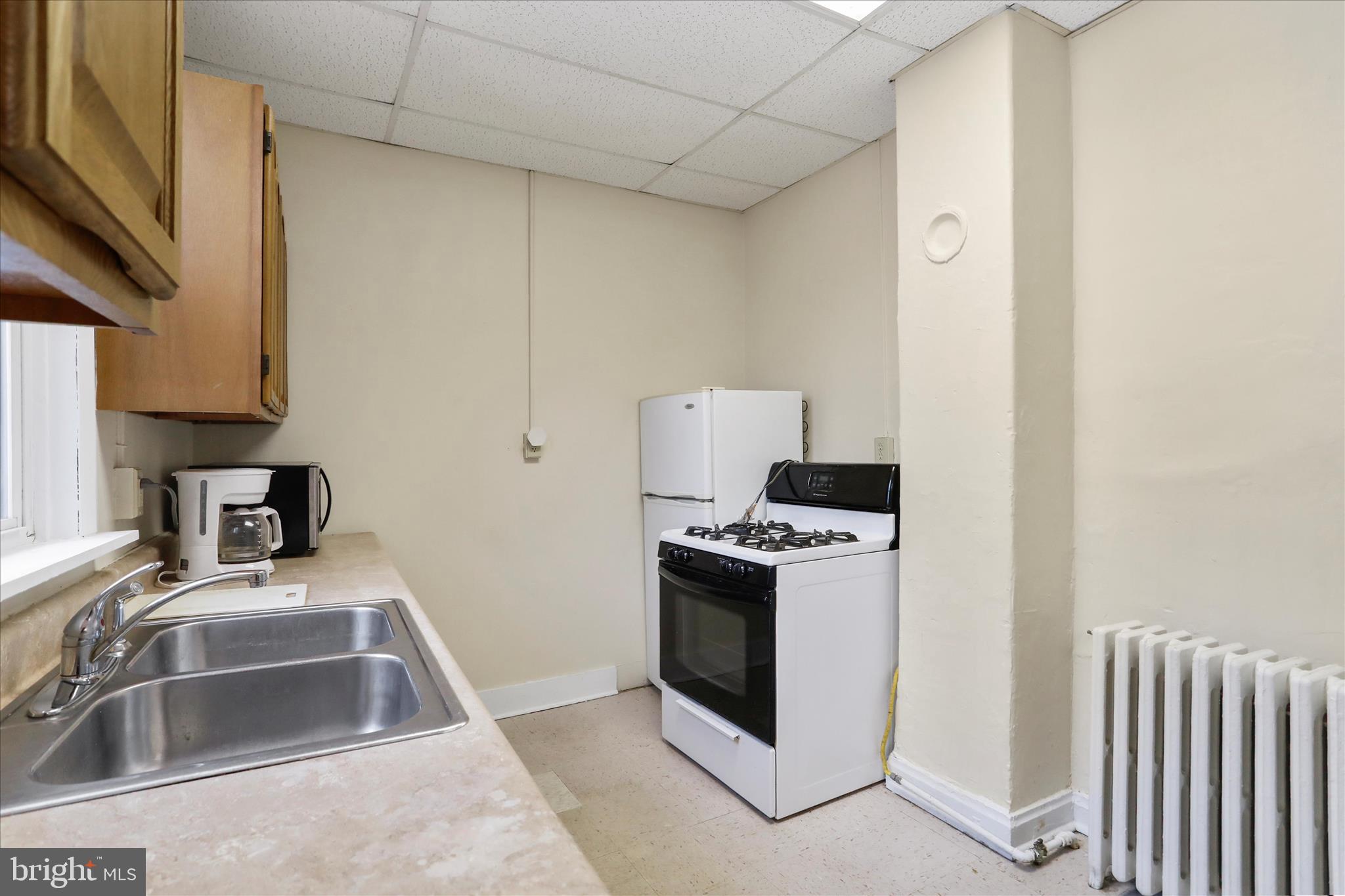 315 Frederick Street Cumberland, MD 21502 - Photo 22 of 46 a kitchen that has a sink and a stove