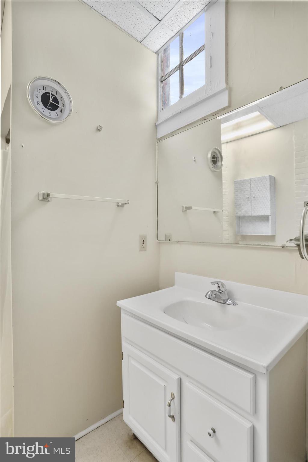 315 Frederick Street Cumberland, MD 21502 - Photo 27 of 46 a bathroom with a sink and a mirror