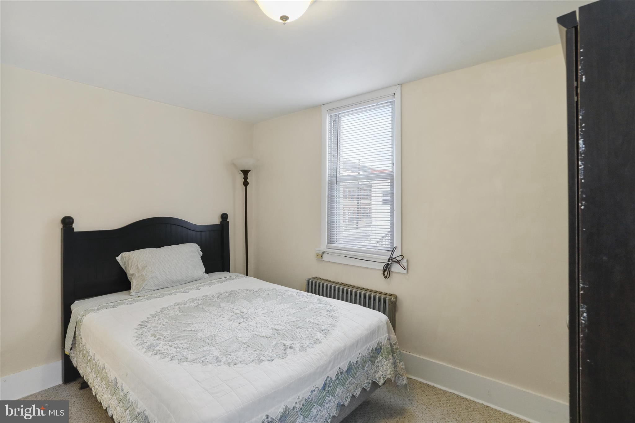 315 Frederick Street Cumberland, MD 21502 - Photo 28 of 46 a bedroom with a bed and window