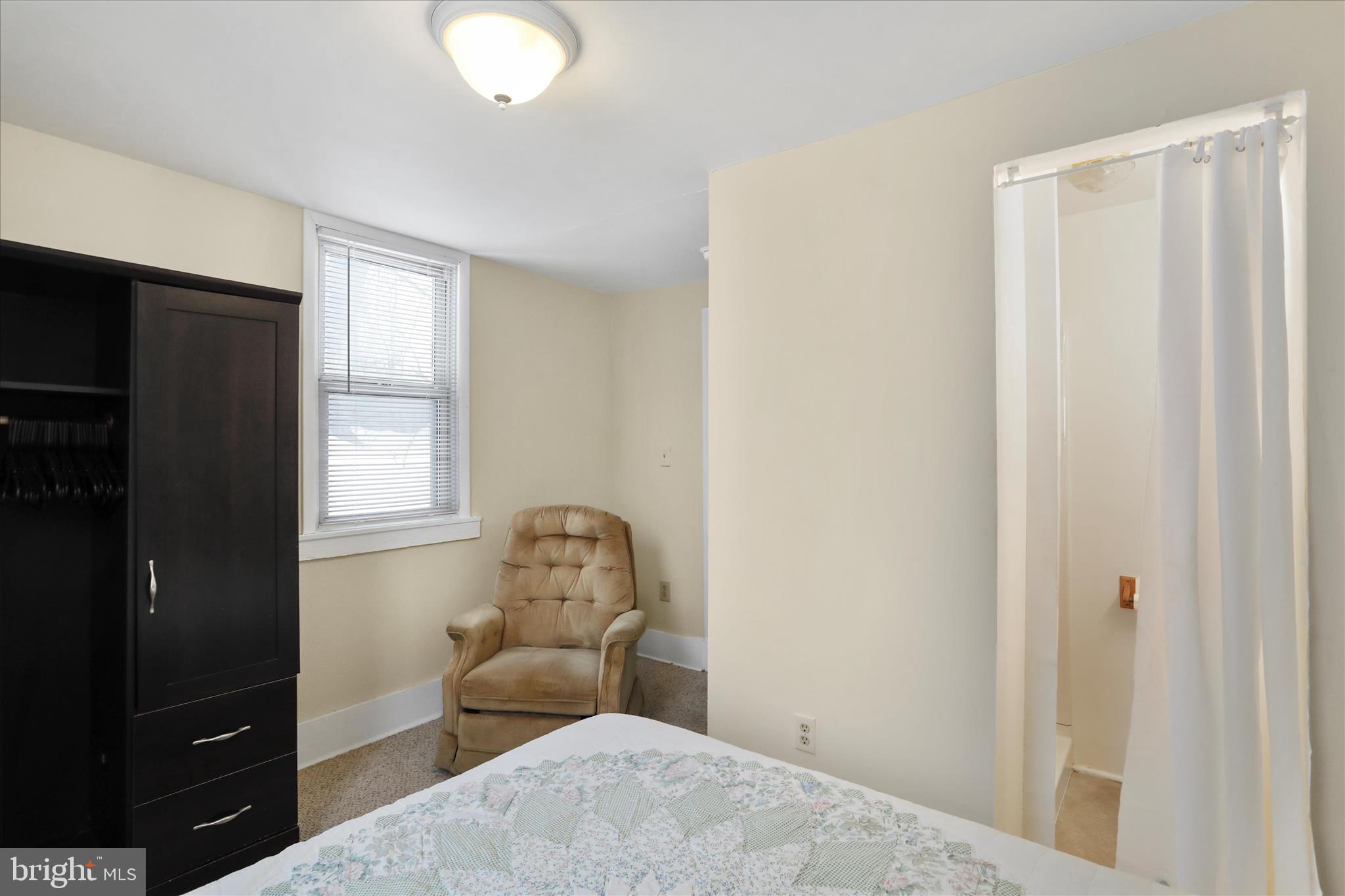 315 Frederick Street Cumberland, MD 21502 - Photo 29 of 46 a bedroom with a bed and a mirror