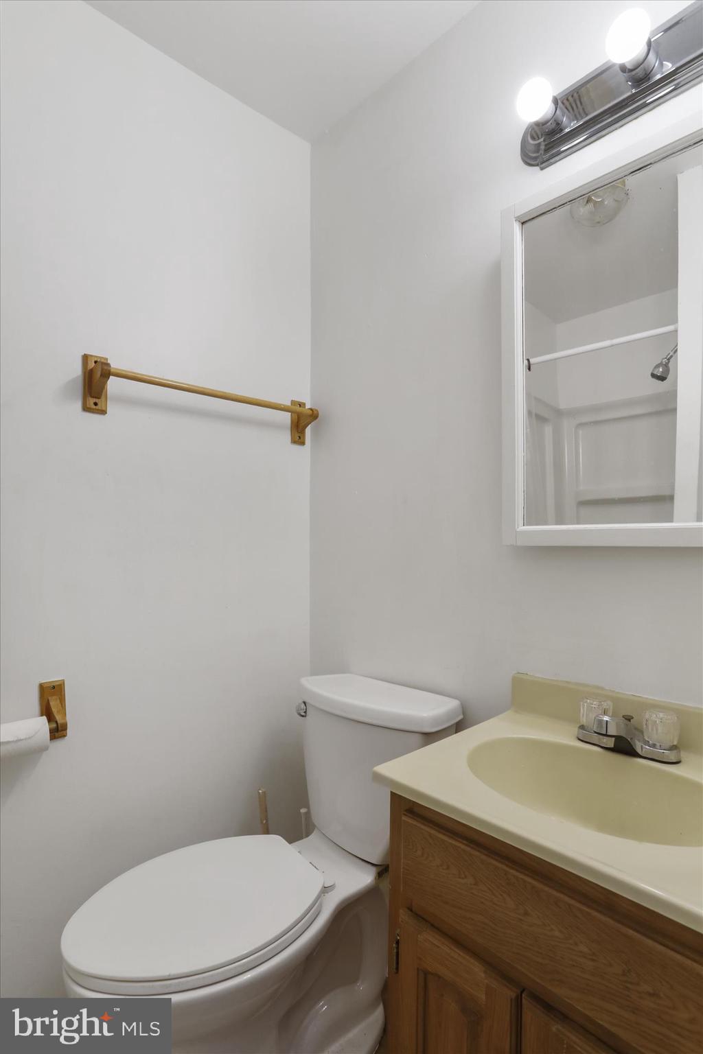 315 Frederick Street Cumberland, MD 21502 - Photo 30 of 46 a white toilet sitting next to a bathroom sink