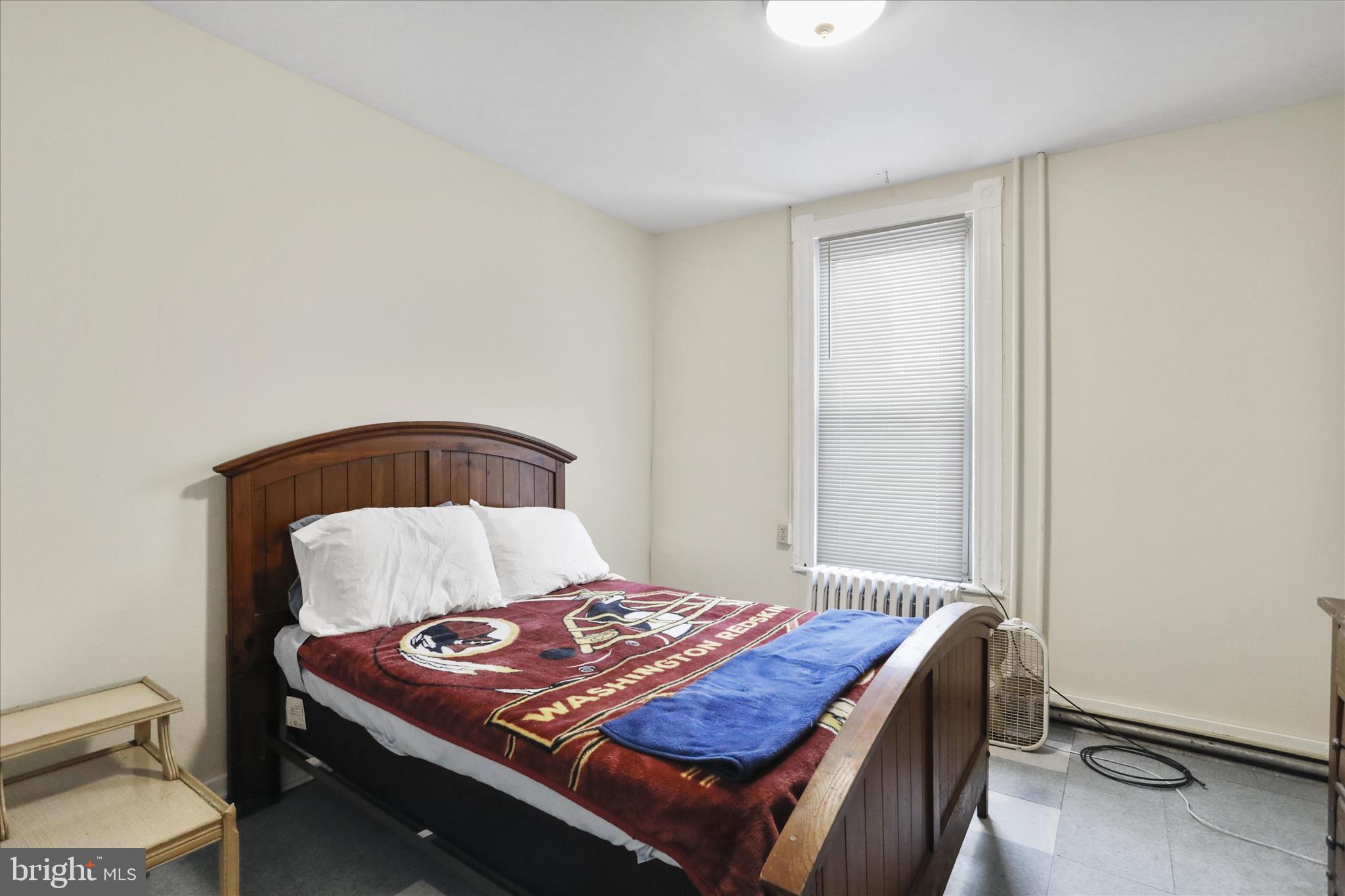 315 Frederick Street Cumberland, MD 21502 - Photo 4 of 46 a bedroom with a bed and a lamp with the table