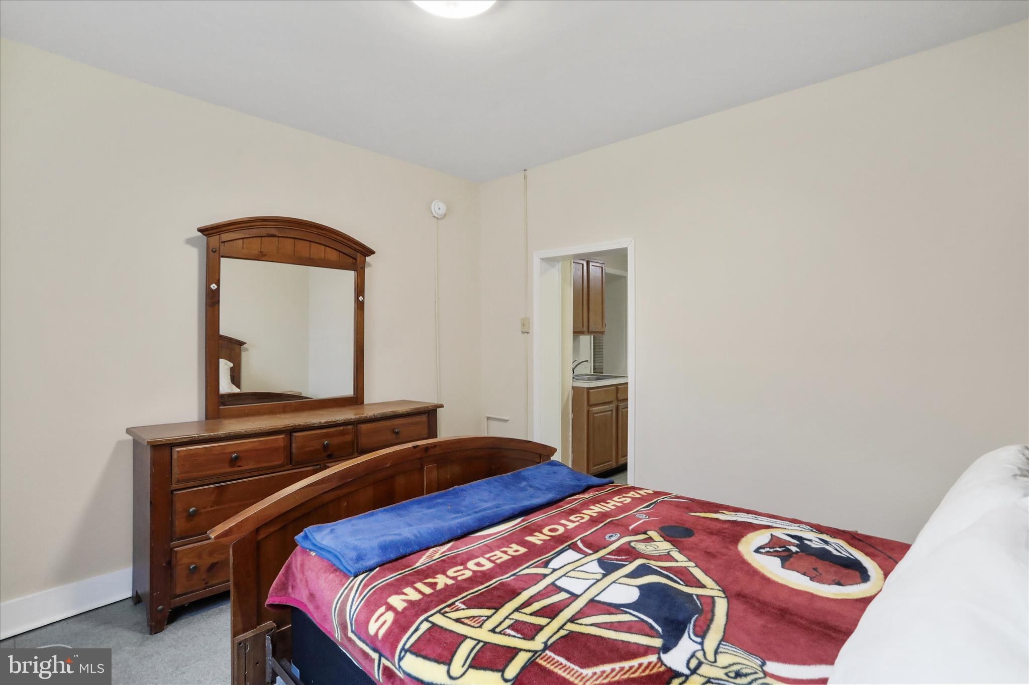 315 Frederick Street Cumberland, MD 21502 - Photo 5 of 46 a bedroom with a bed and a mirror