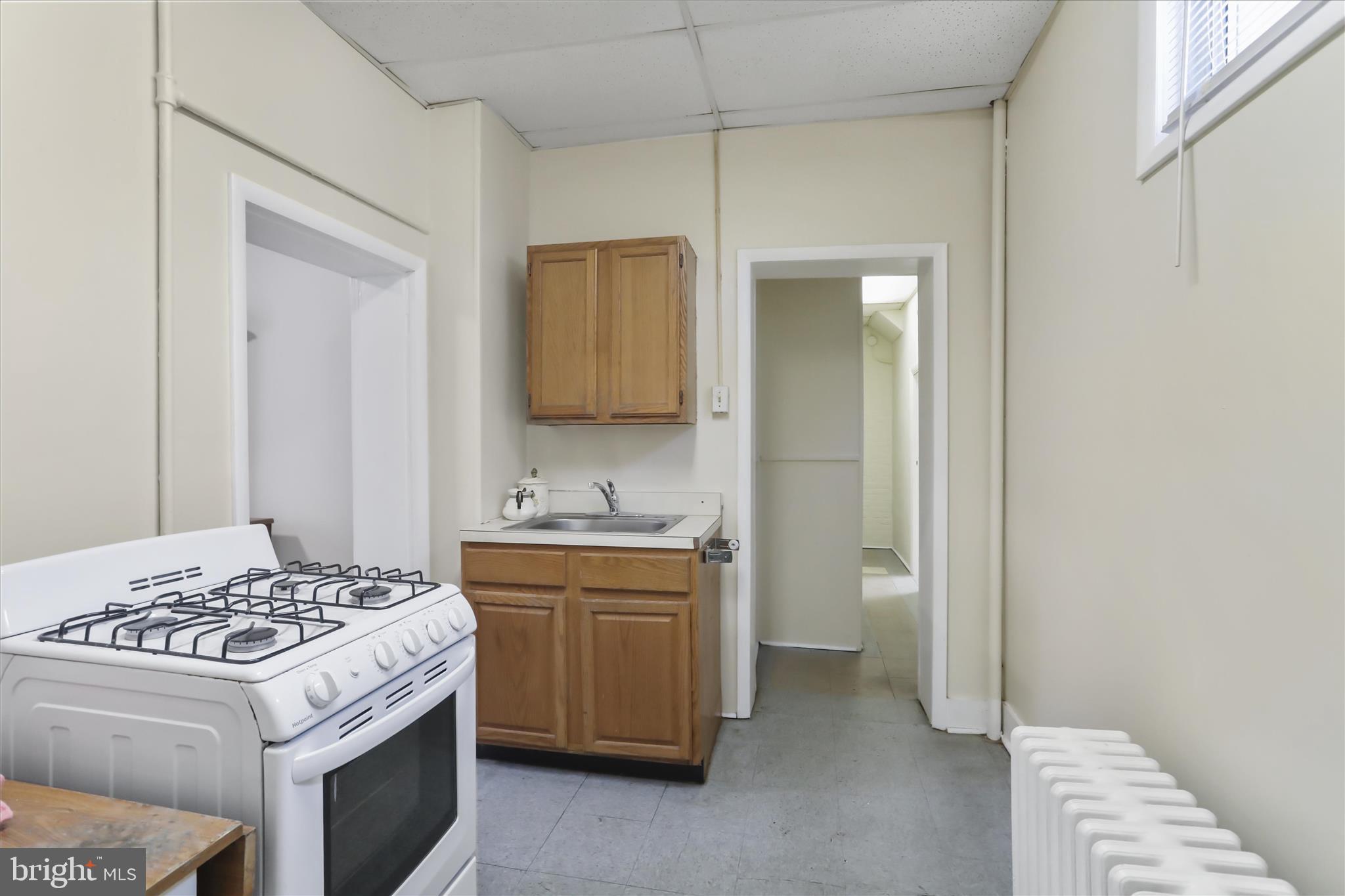 315 Frederick Street Cumberland, MD 21502 - Photo 7 of 46 a kitchen with a stove and a refrigerator