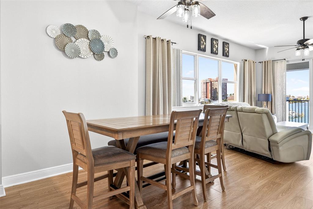 17717 Gulf Boulevard, Unit 401 Redington Shores, FL 33708 - Photo 12 of 66 a view of a dining room with furniture and a large window