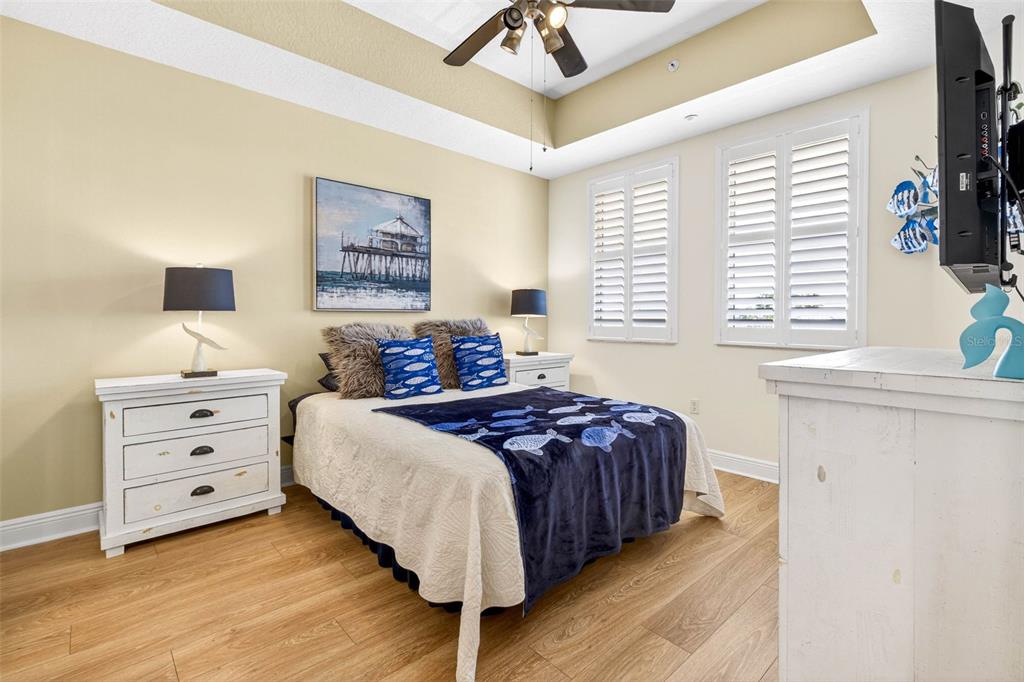 17717 Gulf Boulevard, Unit 401 Redington Shores, FL 33708 - Photo 21 of 66 a bedroom with a bed and a window