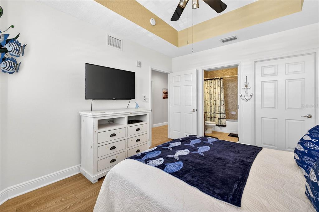 17717 Gulf Boulevard, Unit 401 Redington Shores, FL 33708 - Photo 23 of 66 a living room with furniture and a flat screen tv