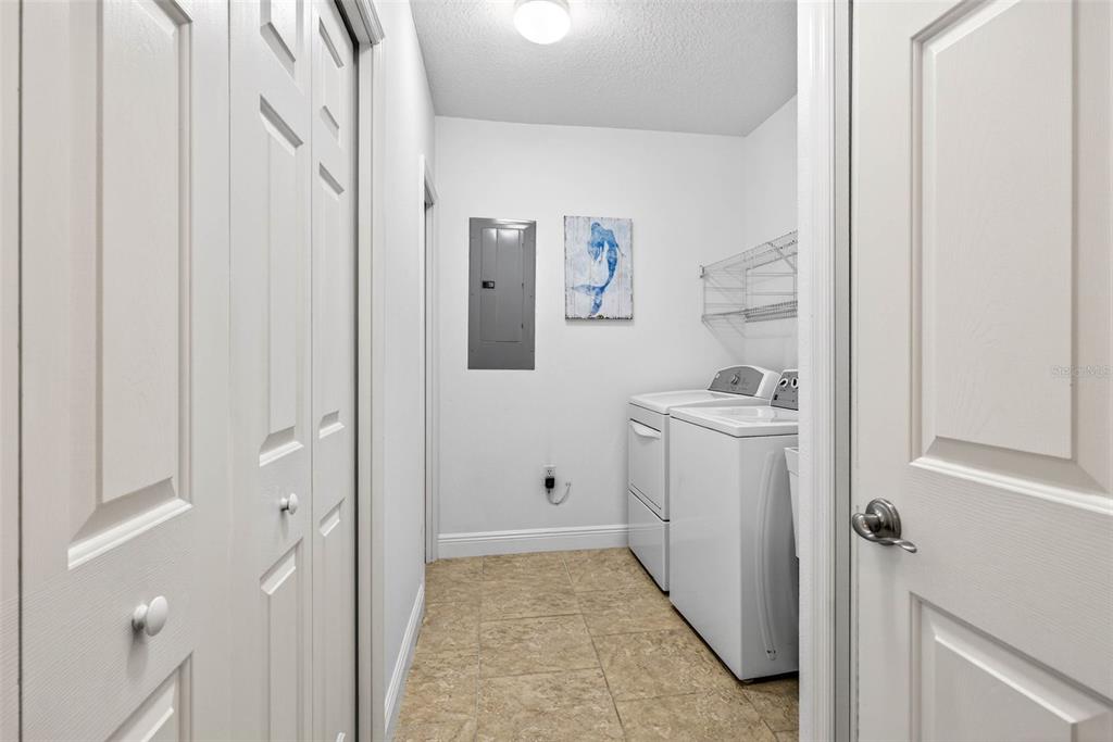 17717 Gulf Boulevard, Unit 401 Redington Shores, FL 33708 - Photo 33 of 66 a bathroom with a sink and mirror with shower