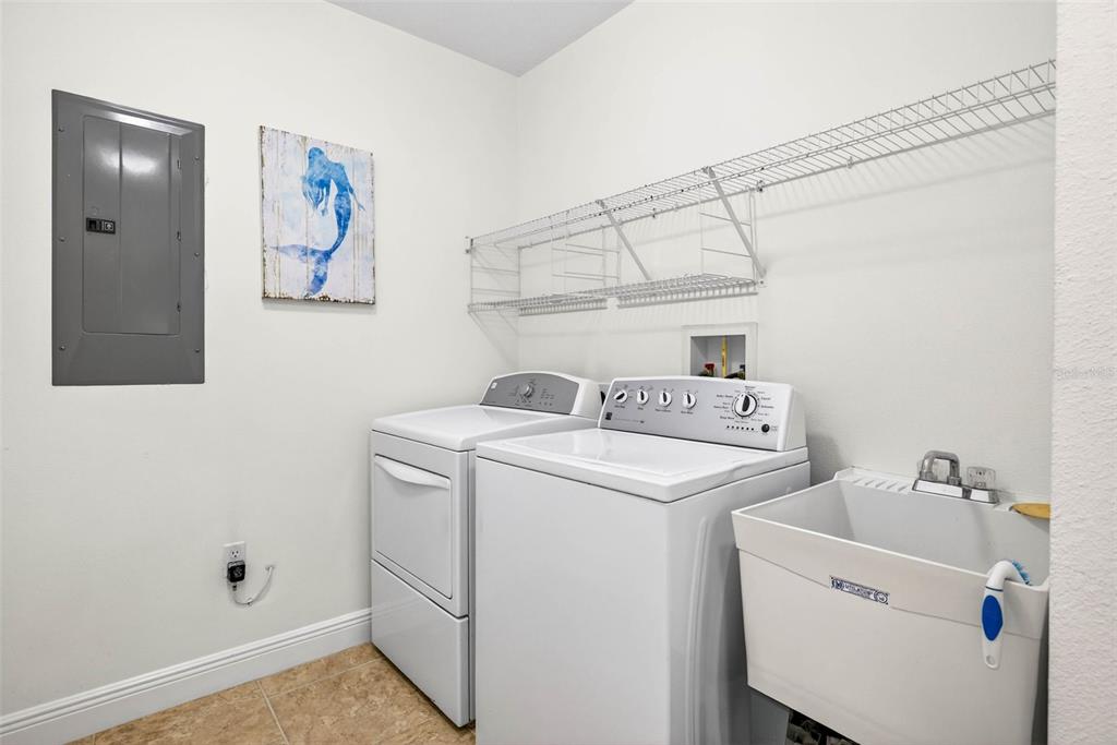 17717 Gulf Boulevard, Unit 401 Redington Shores, FL 33708 - Photo 34 of 66 a utility room with dryer and washer
