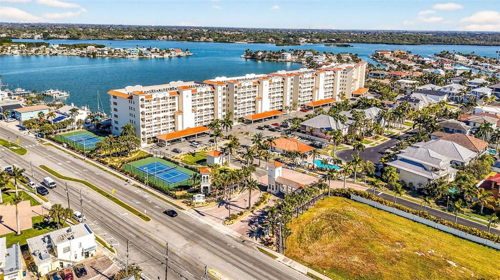 17717 Gulf Boulevard, Unit 401 Redington Shores, FL 33708 - Photo 43 of 66 an aerial view of water body with boats and trees in the background