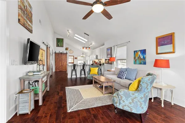 a living room with furniture and a flat screen tv