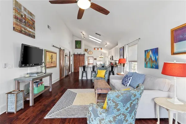 a living room with furniture and a flat screen tv