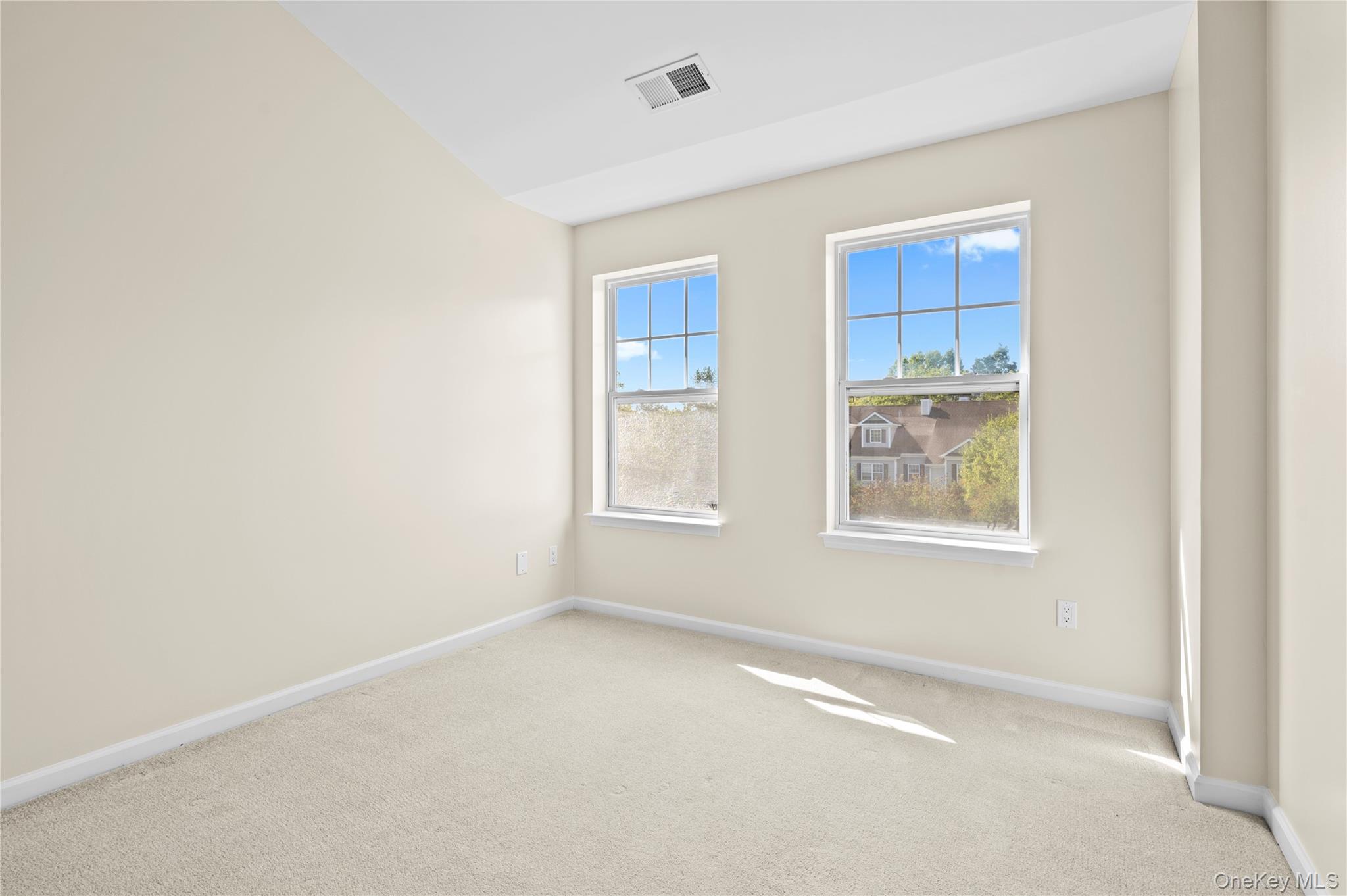19 Putters Way, Unit 9 Middletown, NY 10940 - Photo 12 of 22 second bedroom with light carpet and a closet