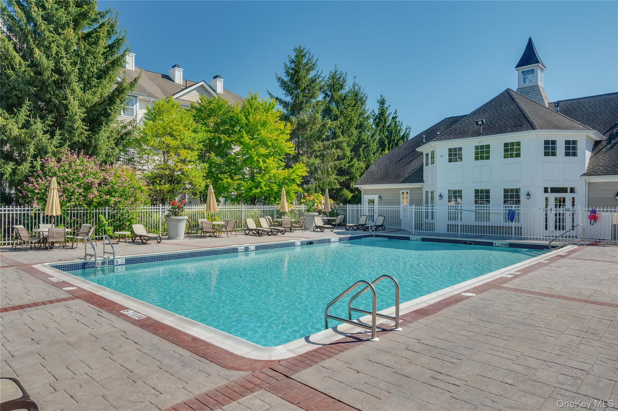 19 Putters Way, Unit 9 Middletown, NY 10940 - Photo 19 of 22 Community pool with a patio area
