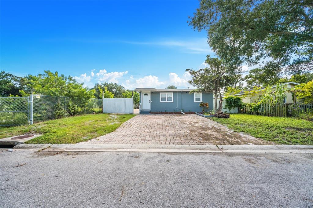 1601 Palm Way Largo, FL 33771 - Photo 1 of 25 a front view of a house with a yard and garage