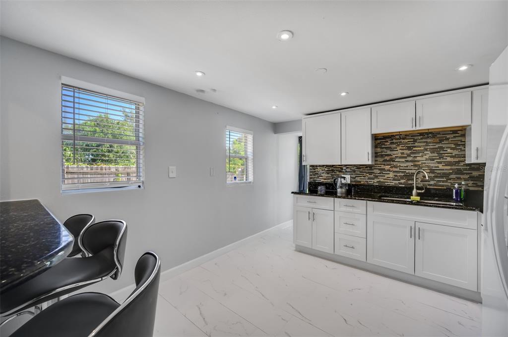 1601 Palm Way Largo, FL 33771 - Photo 12 of 25 a kitchen with a sink appliances and cabinets