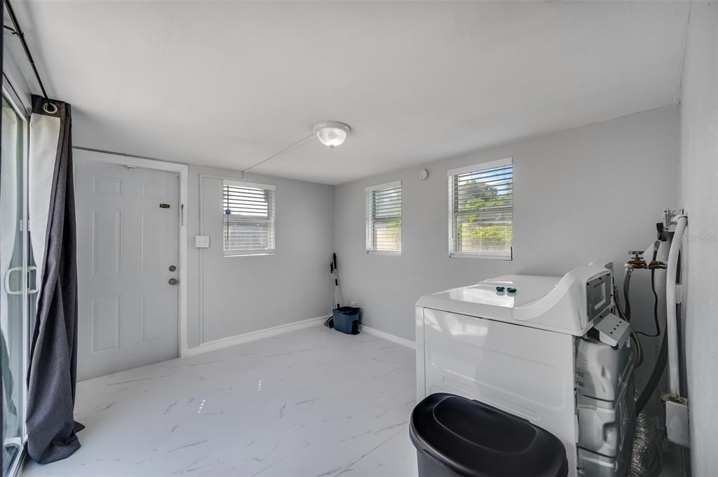 1601 Palm Way Largo, FL 33771 - Photo 13 of 25 a bathroom with a sink toilet and shower