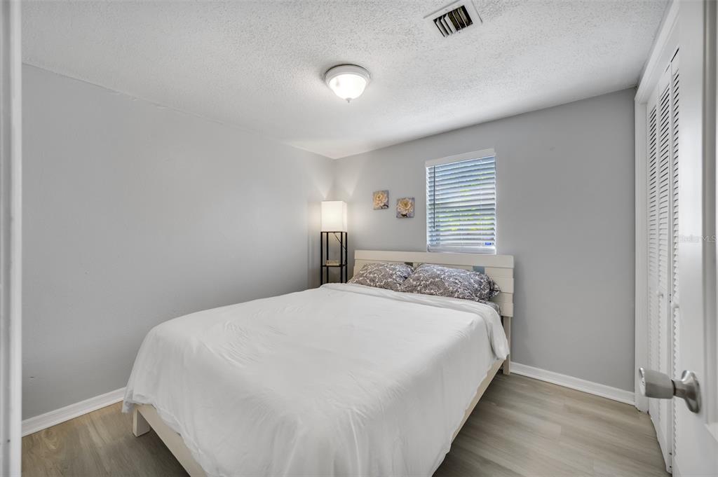 1601 Palm Way Largo, FL 33771 - Photo 16 of 25 a bedroom with a bed and a window