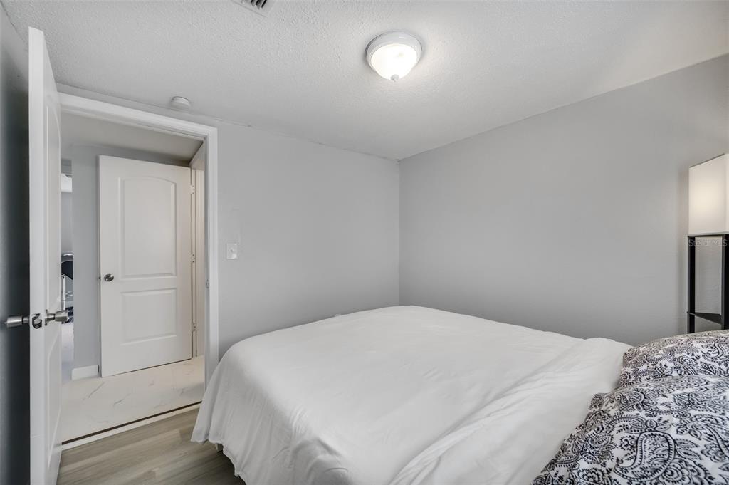 1601 Palm Way Largo, FL 33771 - Photo 18 of 25 a bedroom with a bed and a table