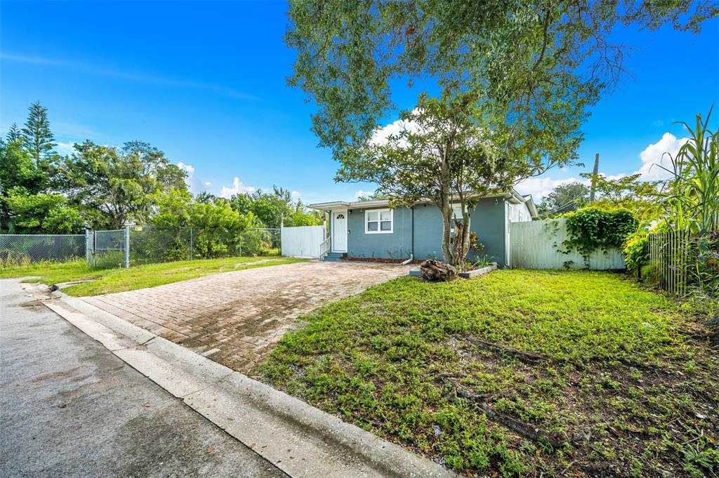 1601 Palm Way Largo, FL 33771 - Photo 2 of 25 a view of a house with a yard and tree s