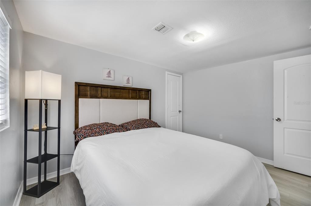 1601 Palm Way Largo, FL 33771 - Photo 22 of 25 a bedroom with a bed and a toilet