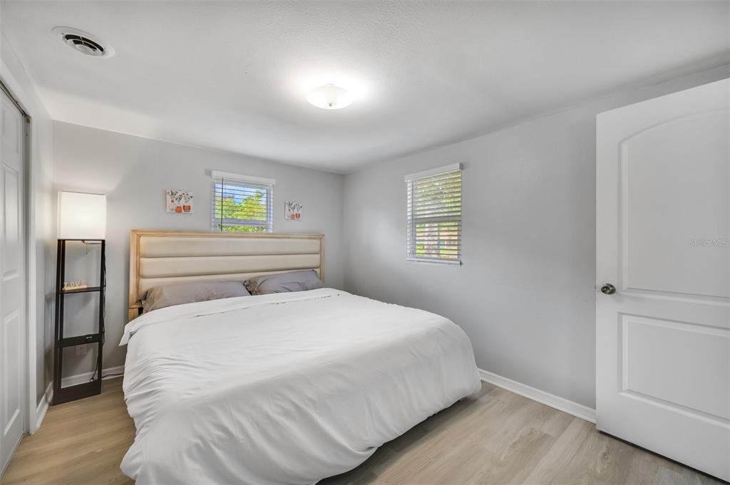1601 Palm Way Largo, FL 33771 - Photo 24 of 25 a bedroom with a bed and painting on the wall