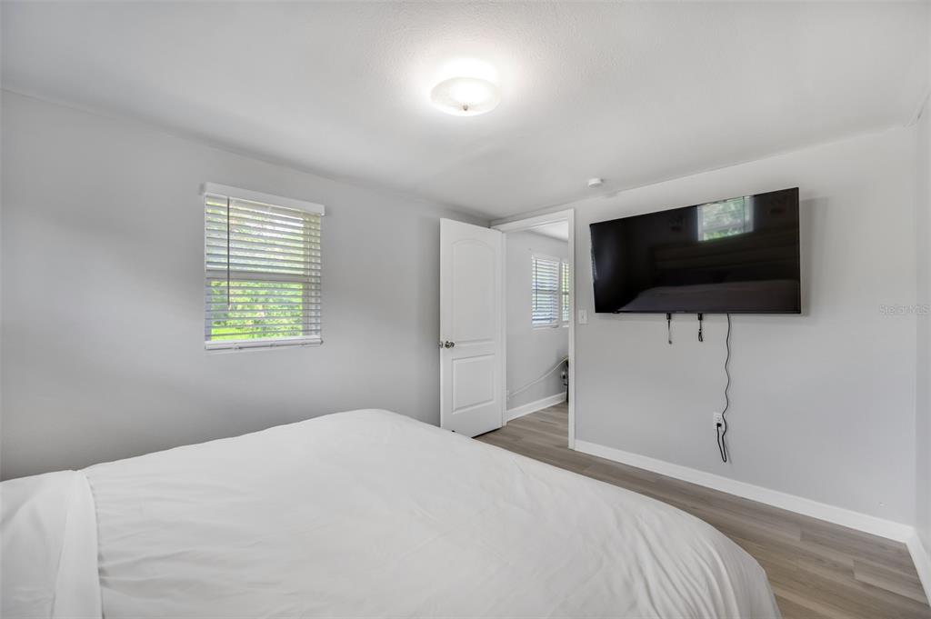 1601 Palm Way Largo, FL 33771 - Photo 25 of 25 a bedroom with a bed and a flat screen tv