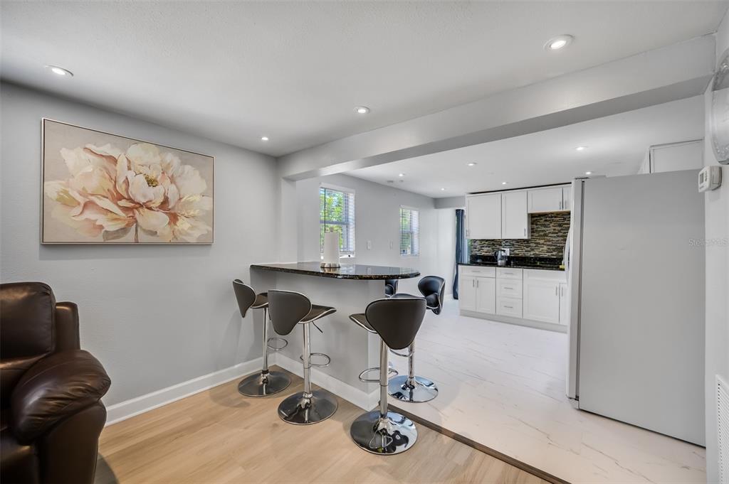 1601 Palm Way Largo, FL 33771 - Photo 8 of 25 a workspace with furniture and kitchen view