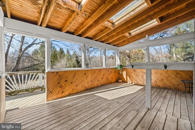 a bathroom with a sink a mirror and a shower